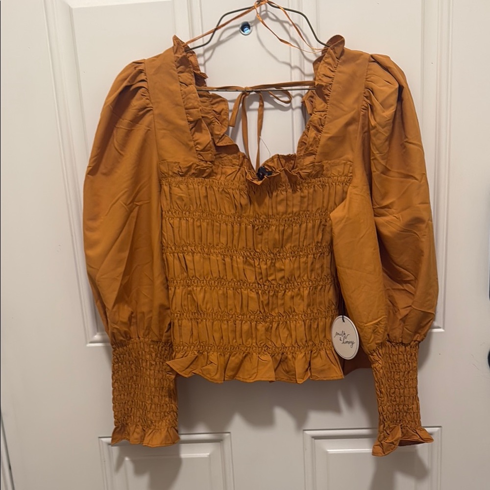 Brown Smocked Blouse with Ruffled Neckline and Puff Sleeves